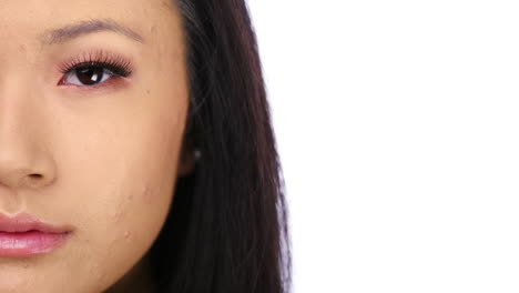 Young-Chinese-woman-portrait-close-up-half-face-character-series-isolated-on-pure-white-background